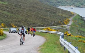 Coxy leads the climbers out of Durness