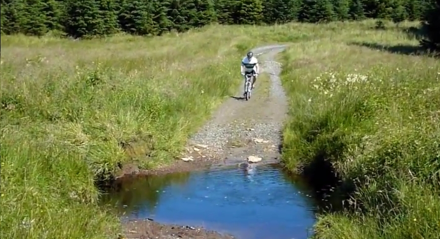 Biker falls in stream